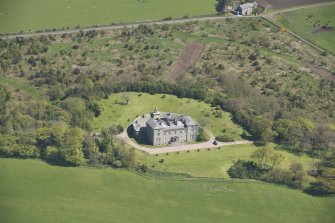 Oblique aerial view of Cairness House, looking to the NE.