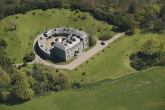 Oblique aerial view of Cairness House, looking to the E.
