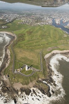 General oblique aerial view of Girdleness centred on Girdleness Lighthouse and Balnagask Golf Course, looking to the WSW.