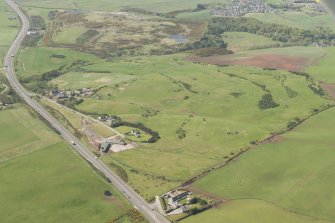 Oblique aerial view of East Abderdeenshire Golf Course, looking to the SW.