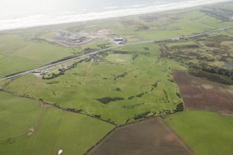 Oblique aerial view of East Abderdeenshire Golf Course, looking to the SE.