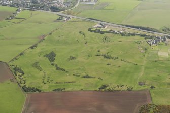 Oblique aerial view of East Abderdeenshire Golf Course, looking to the E.