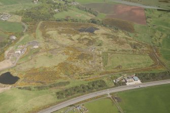 Oblique aerial view of Wester Hatton Sand and Gravel Extraction Site and land fill, looking to the NW.