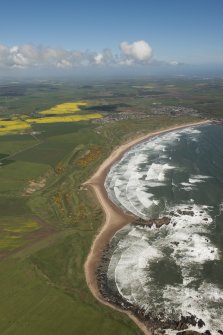 General oblique aerial view of Cruden bay centred on Cruden Bay Golf Courses, looking to the N.