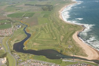 General oblique aerial view of Craigewan Links centred on Peterhead Golf Courses, looking to the N.