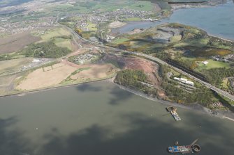Oblique aerial view during construction of the New Forth Bridge Crossing, looking to the NE.