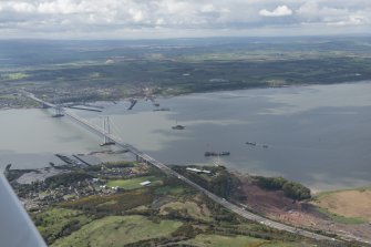 General oblique aerial view of the River Forth centred on the construction of the new  Forth Bridge crossing, looking to the SSW.