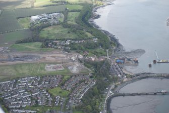 Oblique aerial view during construction of the New Forth Bridge Crossing, on the south bank to the west of Port Edgar, looking to the W.