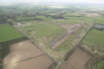 Oblique aerial view of Kirknewton Airfield, looking to the ENE.
