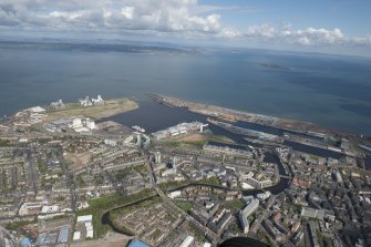 General oblique aerial view of Leith Docks centred on the Caledonia Flour Mills, looking to the NE.