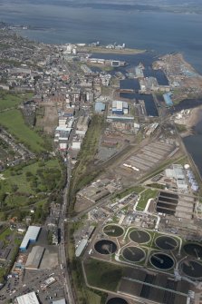 General oblique aerial view of Leith Docks centred on the Western Harbour, looking to the WNW.