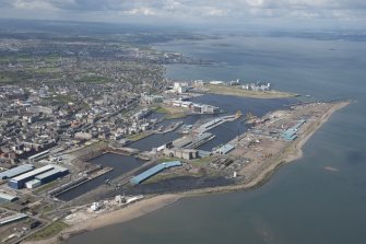 General oblique aerial view of Leith Docks centred on the Western Harbour, looking to the SSW.
