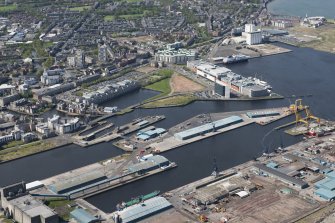 General oblique aerial view of Leith Docks centred on Edinburgh Dock, looking to the SW.