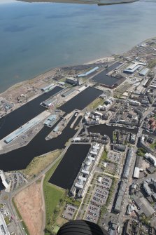 General oblique aerial view of Leith Docks centred on Victoria Docks, looking to the E.