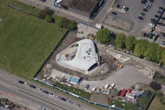 Oblique aerial view of building construction of the Elizabeth Montgomerie Foundation within Aberdeen Royal Infirmary, looking to the NNW.