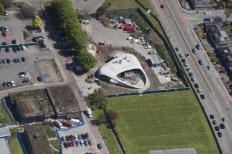 Oblique aerial view of building construction of the Elizabeth Montgomerie Foundation within Aberdeen Royal Infirmary, looking to the SE.