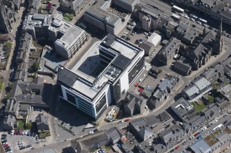 General oblique aerial view of Union Plaza with Gilcomston South Church adjacent, looking to the SSE.