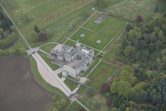 Oblique aerial view of Dunecht House and chapel, looking to the SSE.