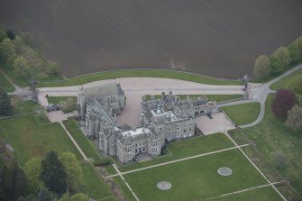 Oblique aerial view of Dunecht House and chapel, looking to the NNE.