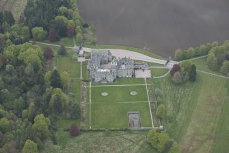Oblique aerial view of Dunecht House and chapel, looking to the N.