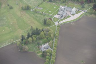 General oblique aerial view of Dunecht House, chapel and stable blocks, looking to the SW.