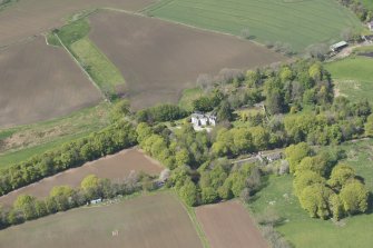 General oblique aerial view of Corsindae House with adjacent walled garden, looking to the NNW.