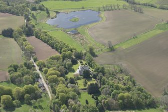 General oblique aerial view of Corsindae House with adjacent walled garden, looking to the WSW.