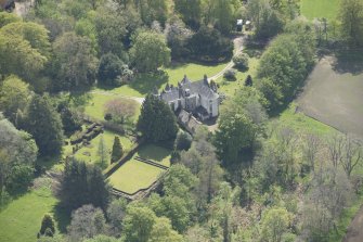 Oblique aerial view of Corsindae House with adjacent walled garden, looking to the SSW.