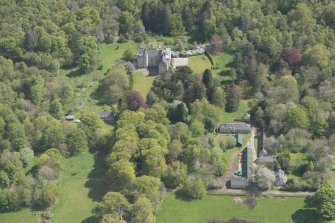 General oblique aerial view of Kemnay House with adjacent farm house, looking to the SSE.