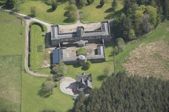 Oblique aerial view of Cluny Castle stable blocks, looking to the SE.