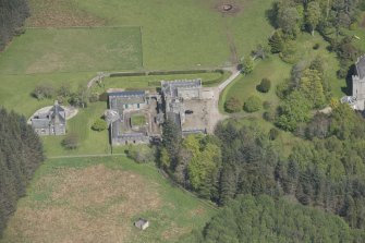 Oblique aerial view of Cluny Castle stable blocks, looking to the NE.