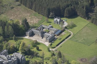 Oblique aerial view of Cluny Castle stable blocks, looking to the W.