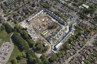 General oblique aerial view of the construction site of Oakhill Grange Housing Estate on the site of the former Oakbank Approved School, looking to the SSE.