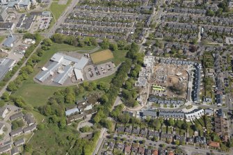 General oblique aerial view of the construction site of Oakhill Grange Housing Estate on the site of the former Oakbank Approved School with Beechwood School adjacent, looking to the ENE.