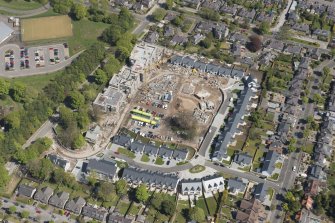 General oblique aerial view of the construction site of Oakhill Grange Housing Estate on the site of the former Oakbank Approved School, looking to the NE.