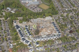 General oblique aerial view of the construction site of Oakhill Grange Housing Estate on the site of the former Oakbank Approved School, looking to the N.