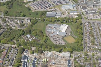 General oblique aerial view of the construction site of Oakhill Grange Housing Estate on the site of the former Oakbank Approved School, looking to the N.