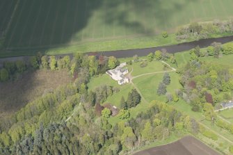 General oblique aerial view of Monymusk House estate centred on Monymusk House, looking to the NE.
