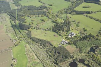 General oblique aerial view of Cluny Castle estate centred on Cluny Castle with Cunningar Golf Course adjacent, looking to the ESE.