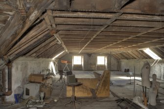 Interior. High Mill. Attic. General view of north range, dating from early 19th century. The panelling has been removed to expose the roof timbers of the open truss roof structure. Only two of the original ten roof light openings are unblocked. These are three paned and appear to be original.