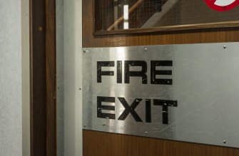 Interior. Detail of signage on Fire door.