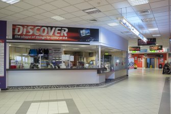 Interior. View of reception desk and concourse into centre