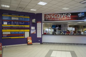 Interior. View of reception desk and concourse into centre