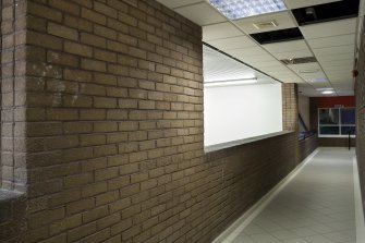 Interior. View from North along squash court viewing corridor.