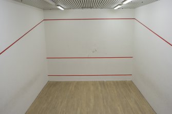 Interior. View from viewing corridor into squash court.