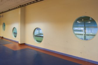 Interior. View of later wall erected within the central corridor, separating the ice rink and carpet bowls halls.