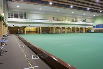 Interior. View from north east corner of the carpet bowls hall, looking back to the viewing balcony with the locker room below.