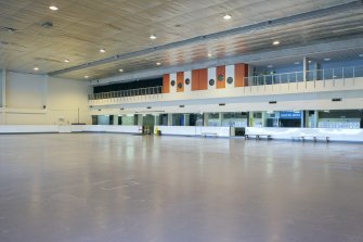 Interior. View from south east looking back across ice rink to the viewing balcony and entrance to theatre at the upper level, with skate changing area below.
