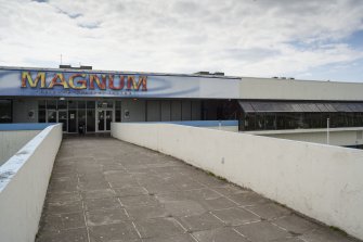 View looking along footbridge to the main entrance of the Magnum Centre.