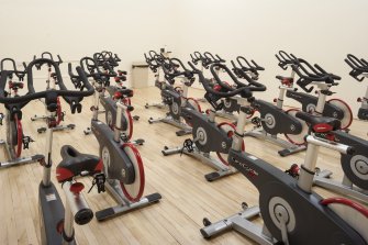 Interior. View of "spin'' class bikes within former squash court.